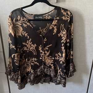 Embroidered top with ruffle at sleeves and hemline